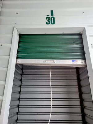 A storage unit with the number 30 on the wall.